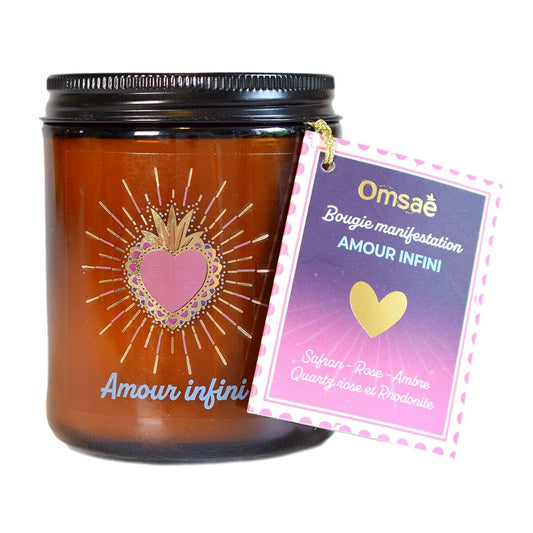 Bougie en pot en verre brun, amour infini en bleu, sacré coeur rose et or, étiquette accroché par un lien Omsaé, parfum safran, rose, ambre, cristaux quartz rose et rhodonite