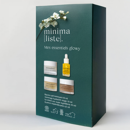 Coffret découverte minimaliste mes essentiels glowy, en carton vert bouteille, branche de fleurs, comprenant une crème, un sérum, un gommage et un baume démaquillant