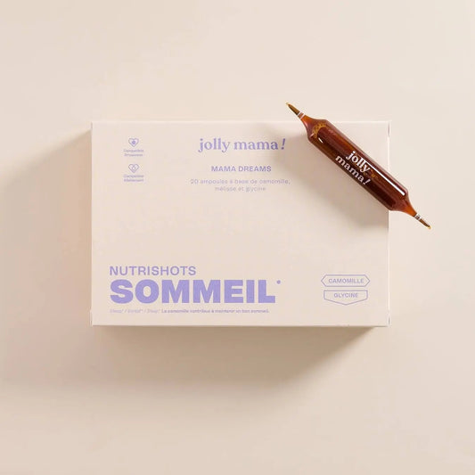 Boîte de 20 ampoules Mama Dreams Nutrishots Sommeil de Jolly Mama sur fond beige, avec une ampoule ambrée posée en diagonale
