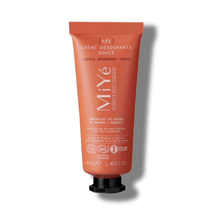 Tube orange et son bouchon noir de crème déodorante douce de la marque MiYé