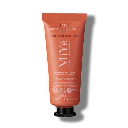 Tube orange et son bouchon noir de crème déodorante douce de la marque MiYé