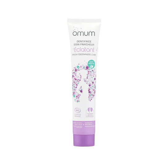 Tube blanc et bouchon violet de dentifrice bio Omum l'Éclatant, sans fluor, soin fraicheur et dents et gencives sensibles, compatible grossesse et allaitement 