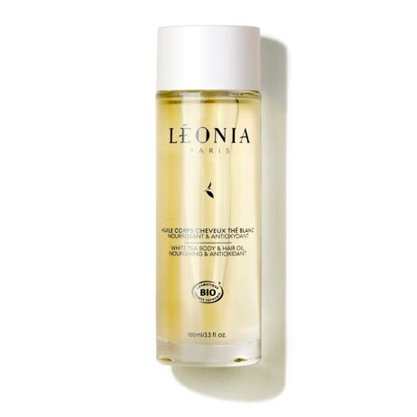 Flacon verre et bouchon blanc d’huile corps et cheveux au thé blanc bio Léonia 100 ml sur fond blanc