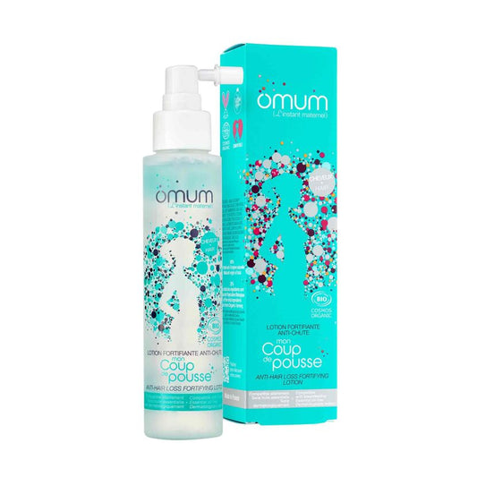 Lotion fortifiante anti-chûte des cheveux mon coup de pousse Omum en flacon pompe avec dessein de femme sur fond bleu et sa boîte en carton bleu assortie