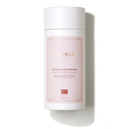 Packshot du Thé Blanc Bio Premium Léonia Paris, boîte cylindrique blanche et rose, 40g, certifié bio